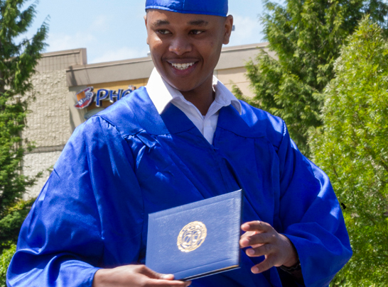 Student Holding Diploma