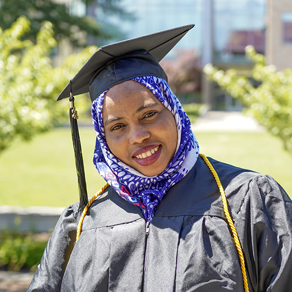 grad wearing black regalia