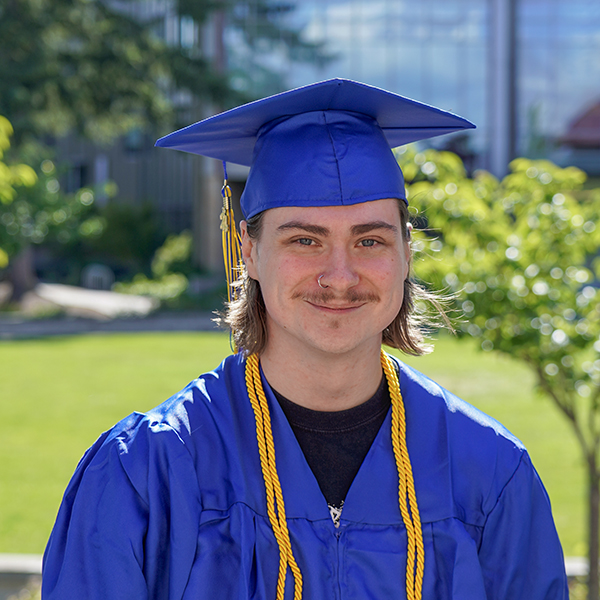 grad with a blue regalia