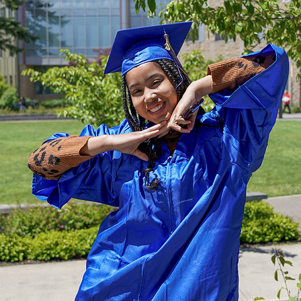 grad wearing blue regalia