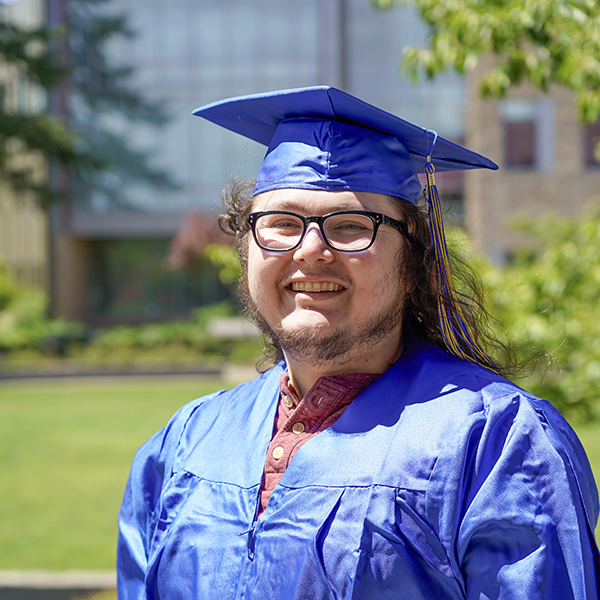 Grad in blue regalia