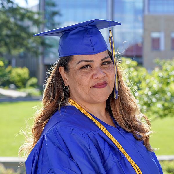 grad wearing blue regalia 