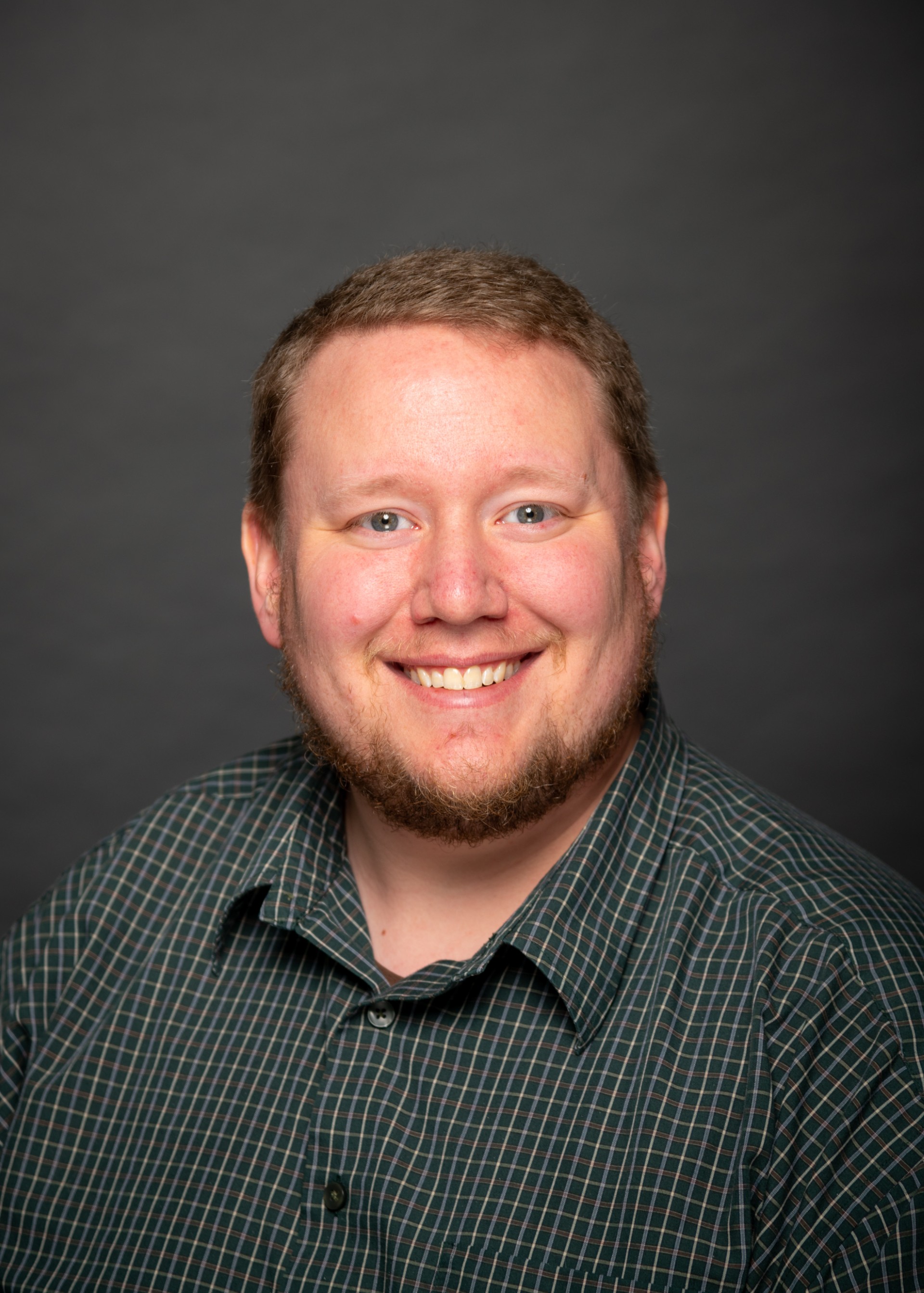 portrait photo of a man smiling. 